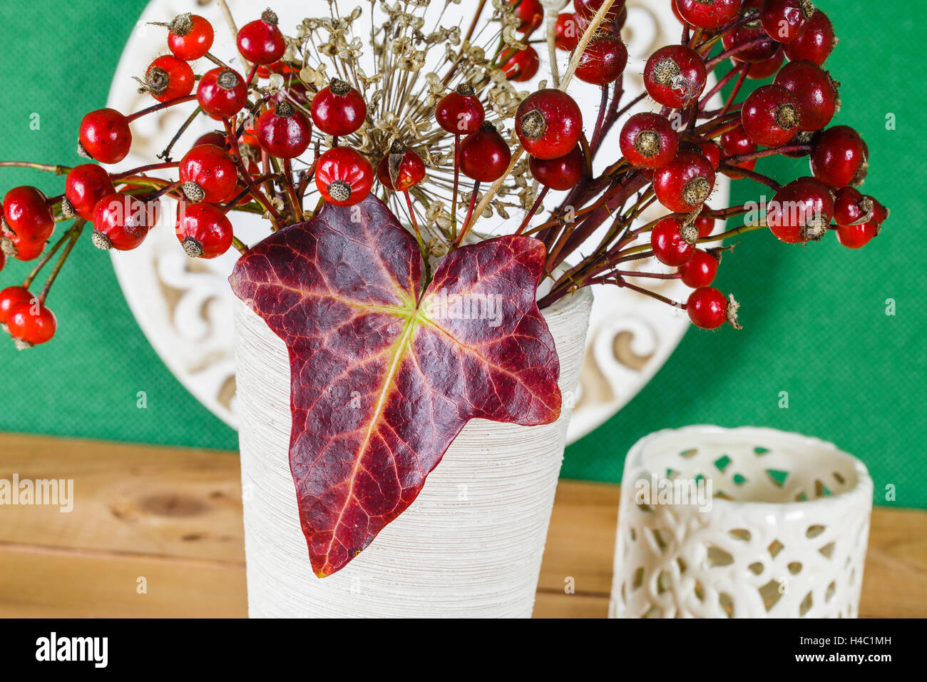 Ivy leaf, rose hip seed, autumn composition, still life, Stock Photo