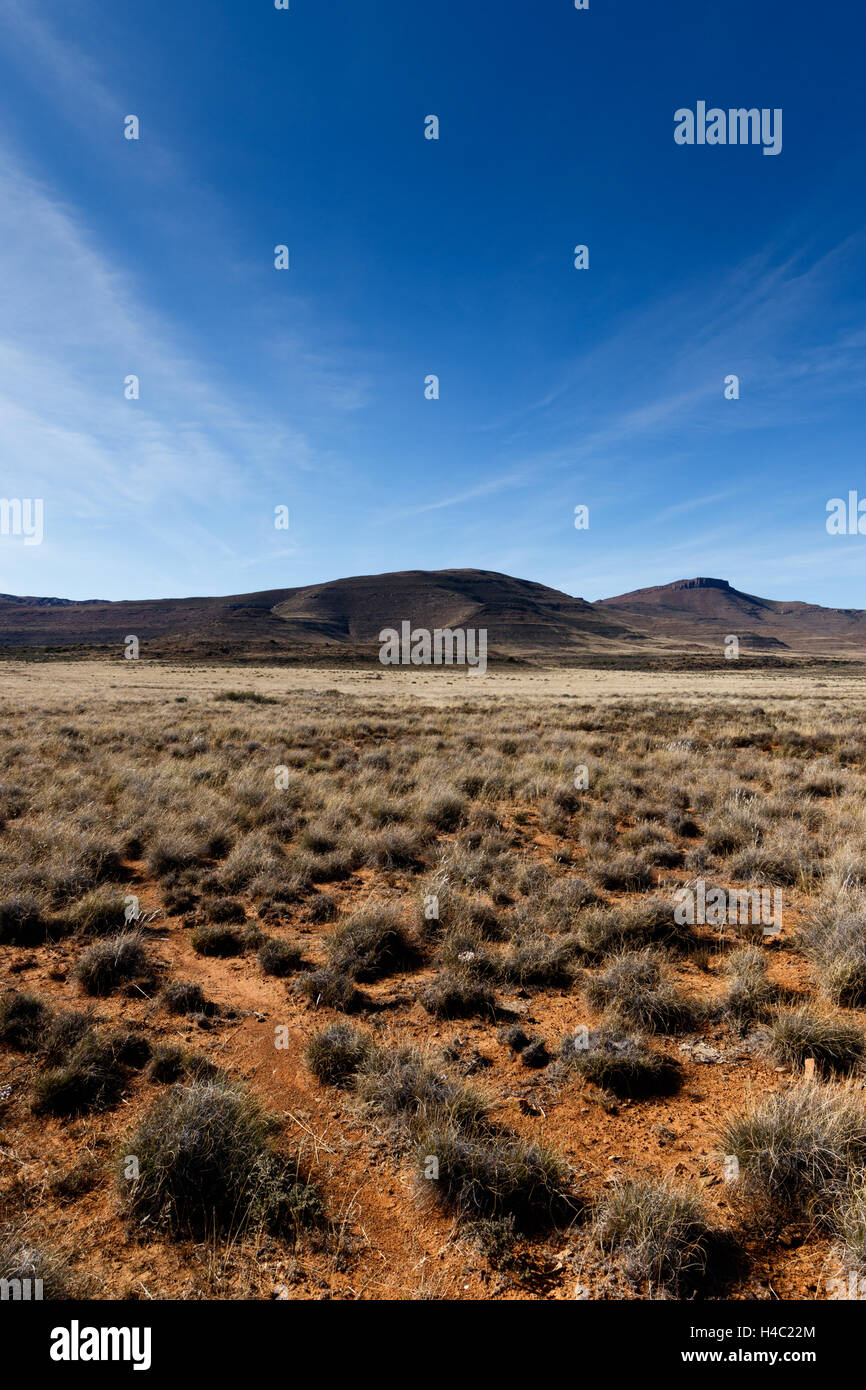 Blue Skies with crater in the side of the mountain. Stock Photo