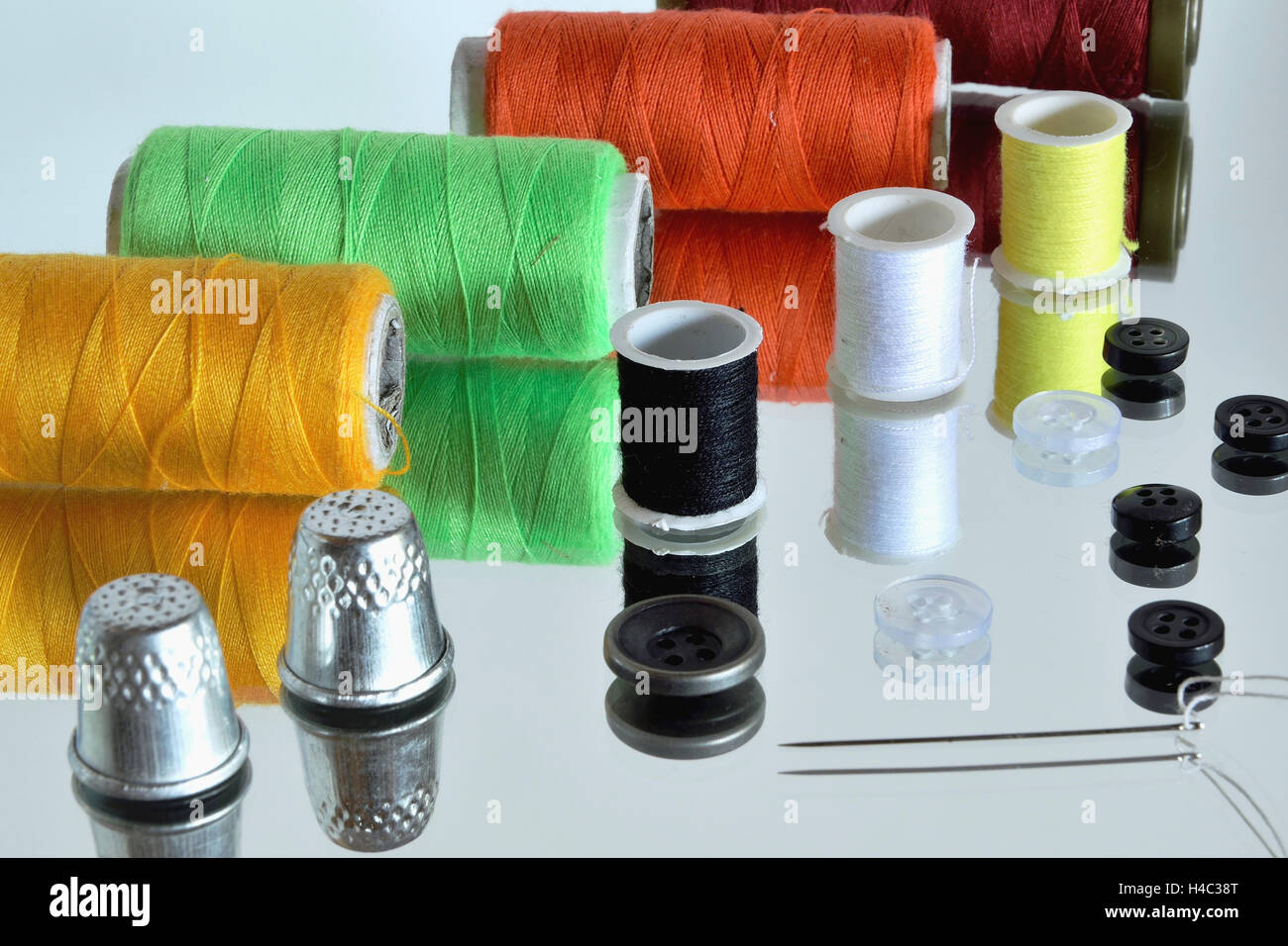 Sewing tools (and there reflection in the mirror Stock Photo Alamy