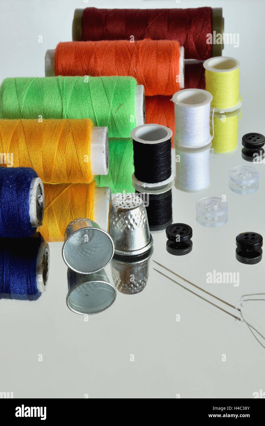 Sewing tools (and there reflection in the mirror Stock Photo Alamy