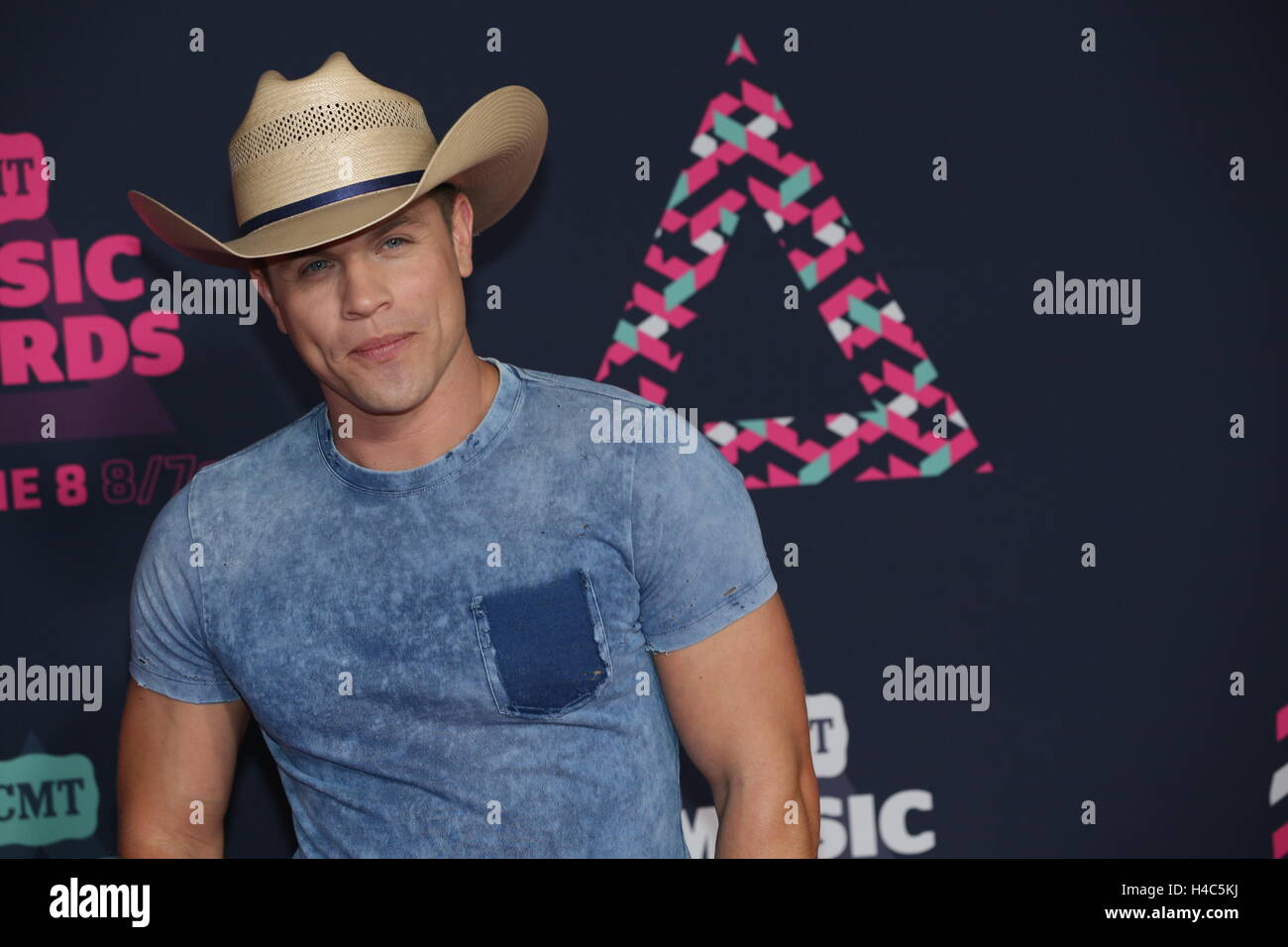 Dustin Lynch walks the red carpet at the CMT Music Awards at