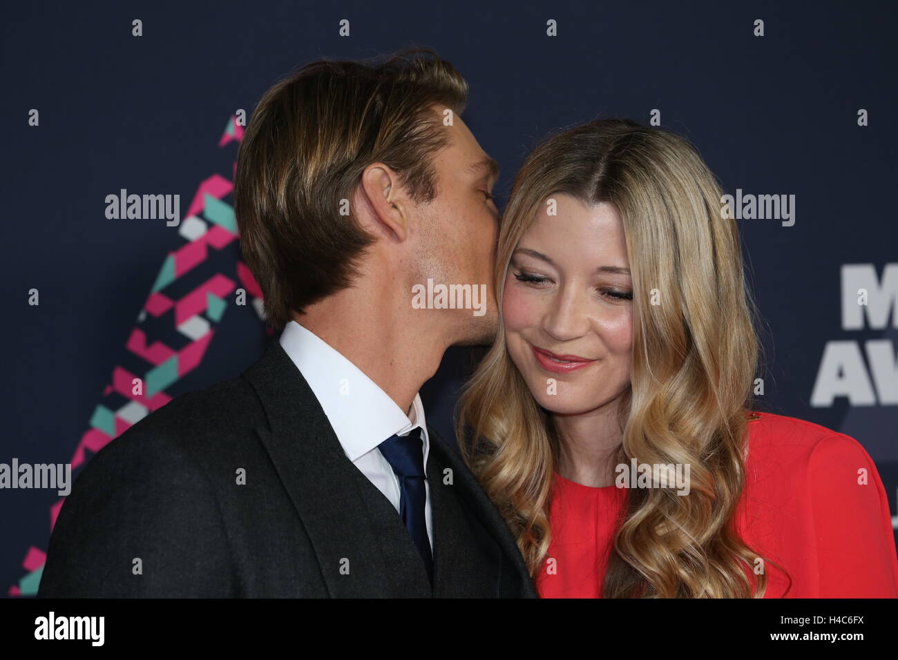 Chad Michael Murray whispers to Sarah Roemer on the red carpet at the CMT Music Awards at Bridgestone Arena on June 8th, 2016 in Nashville, TN. Stock Photo