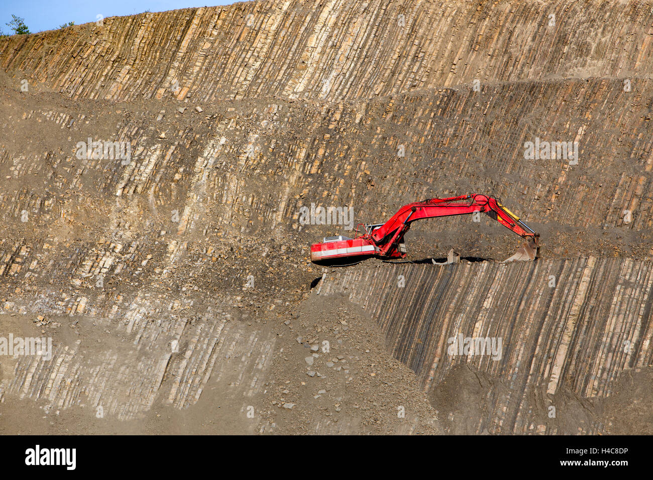 Red digger in stone-pit Stock Photo - Alamy