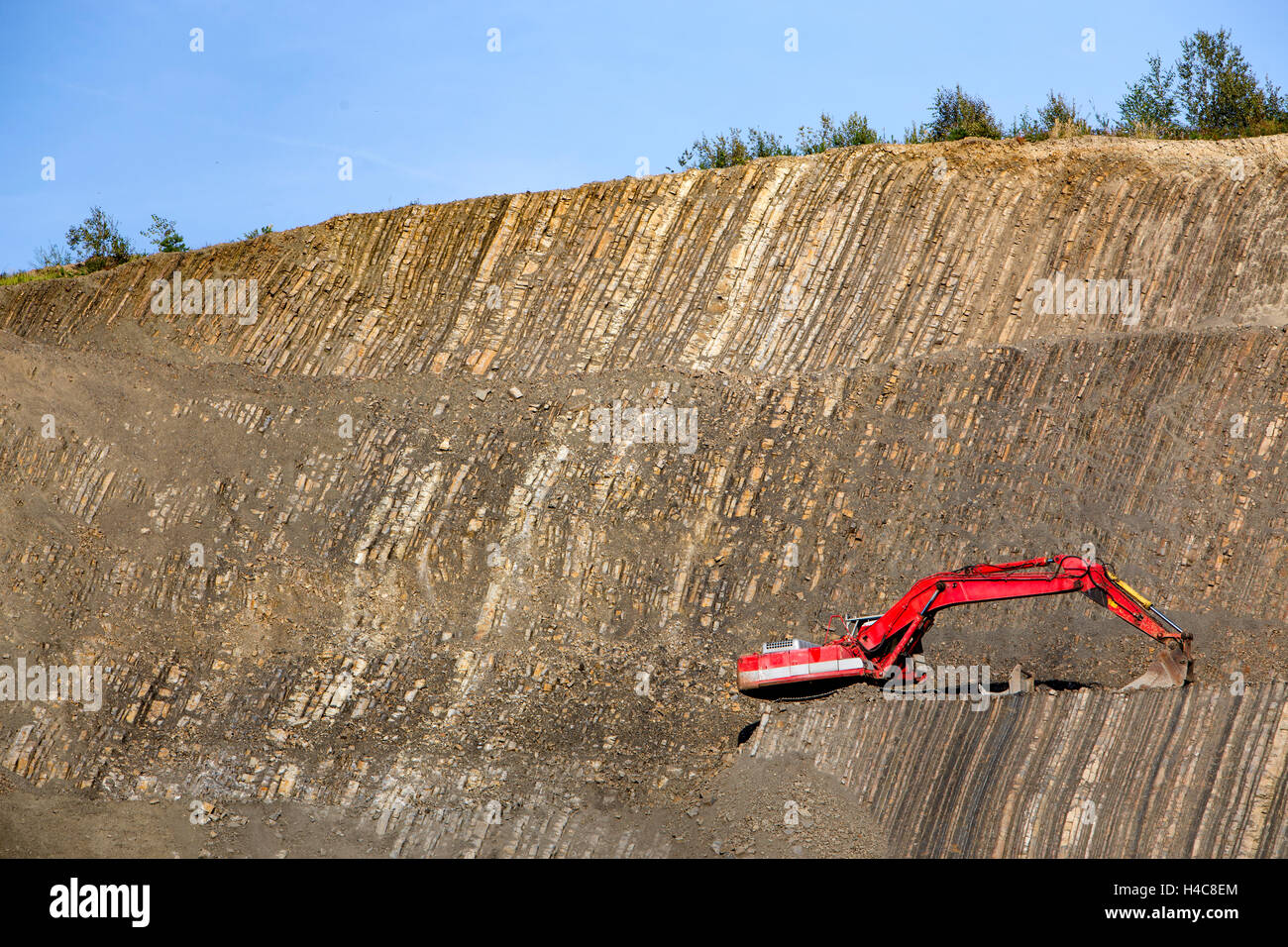 Red digger in stone-pit Stock Photo - Alamy