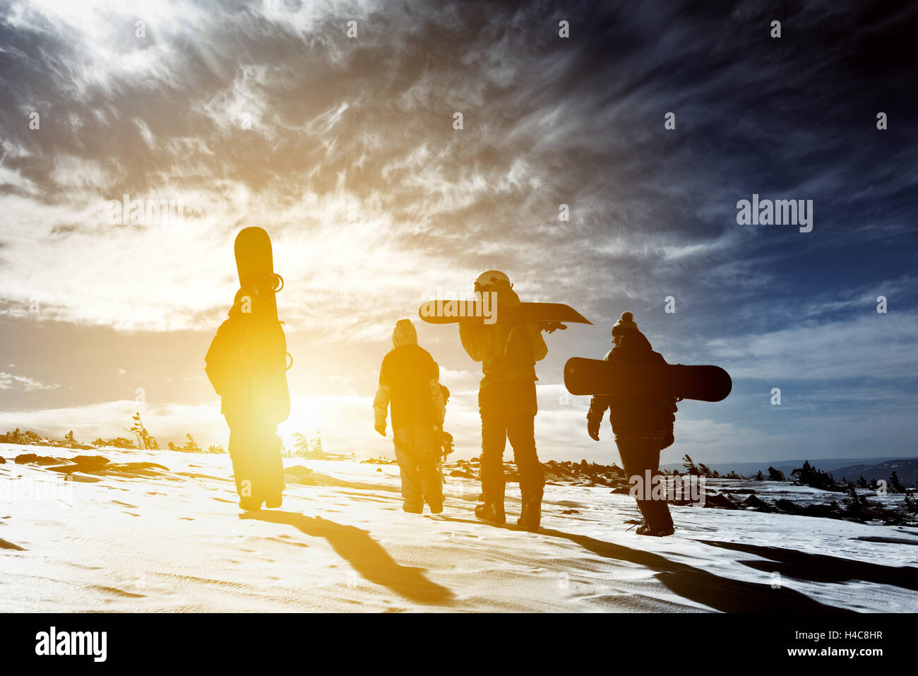 Group snowboarders snowboarding skiing concept Stock Photo