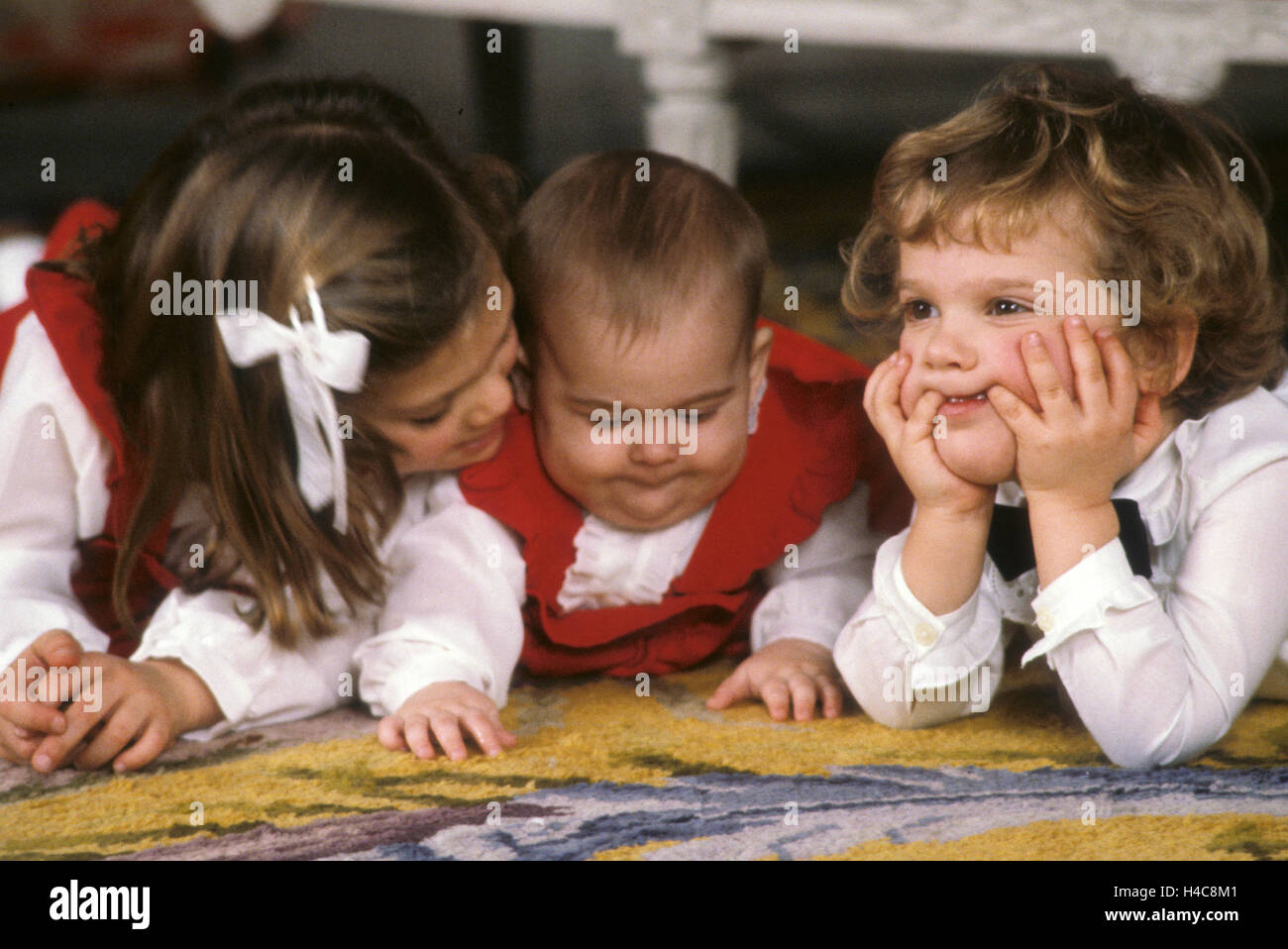 ROYAL FAMILY for Christmas at Stockholm Castle,Crown Princess Victoria with siblings on the floor Stock Photo
