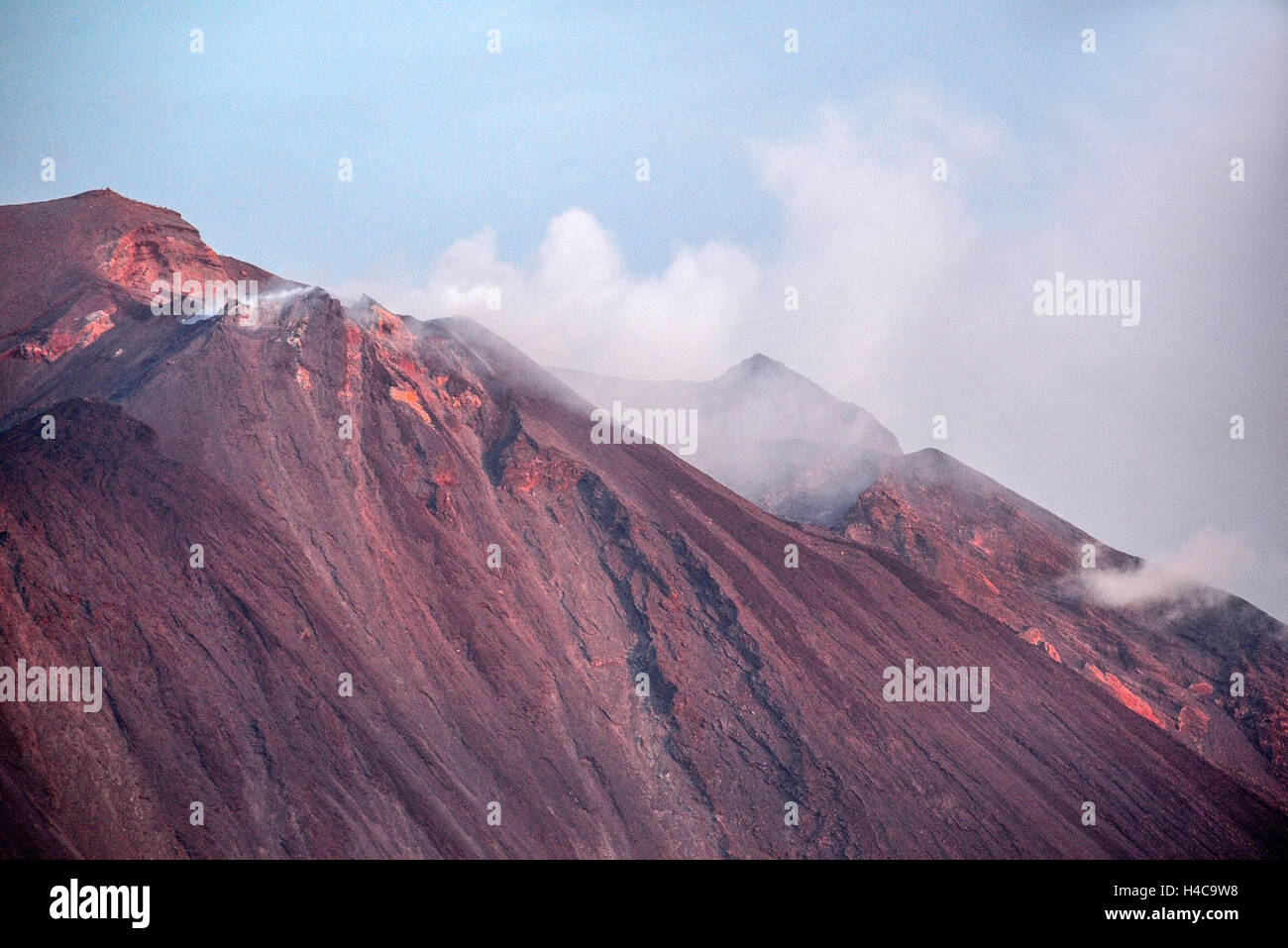 Italy Sicily Aeolian Islands Stromboli Island The volcano crater during an eruption after sunset Stock Photo