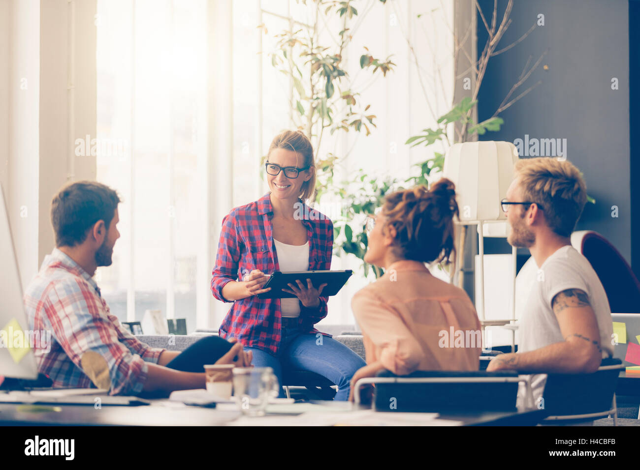 Young business people working at office on new project Stock Photo - Alamy