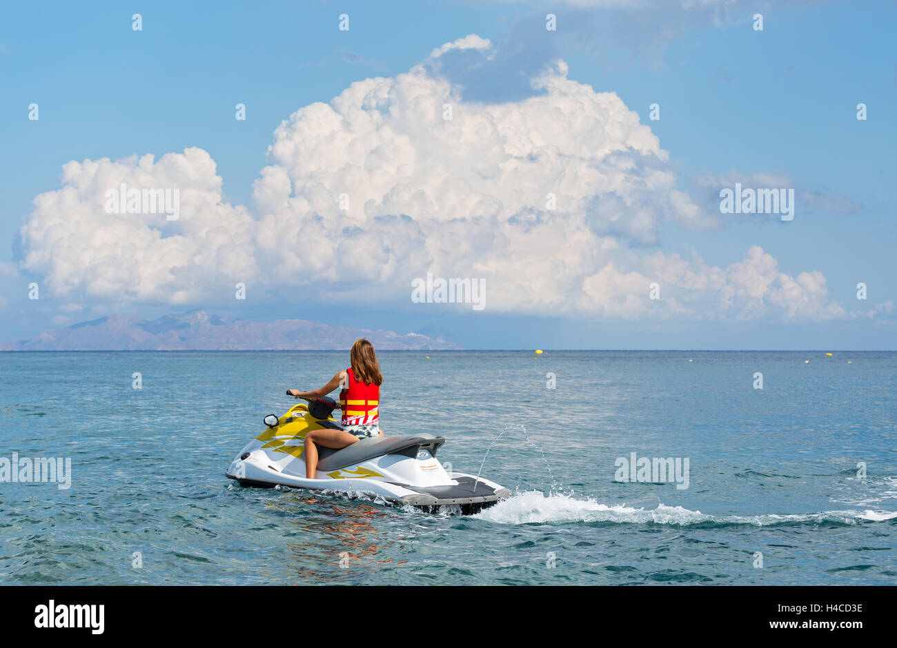 Women rides scooter hires stock photography and images Alamy