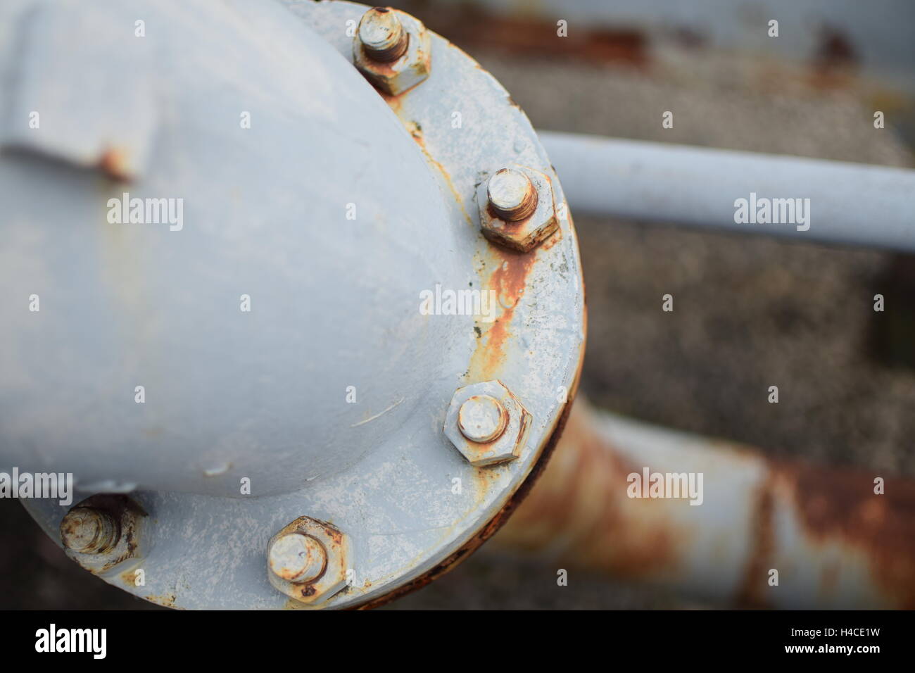 Large Pipe Line Connected with Rusty Metal Bolts Stock Photo