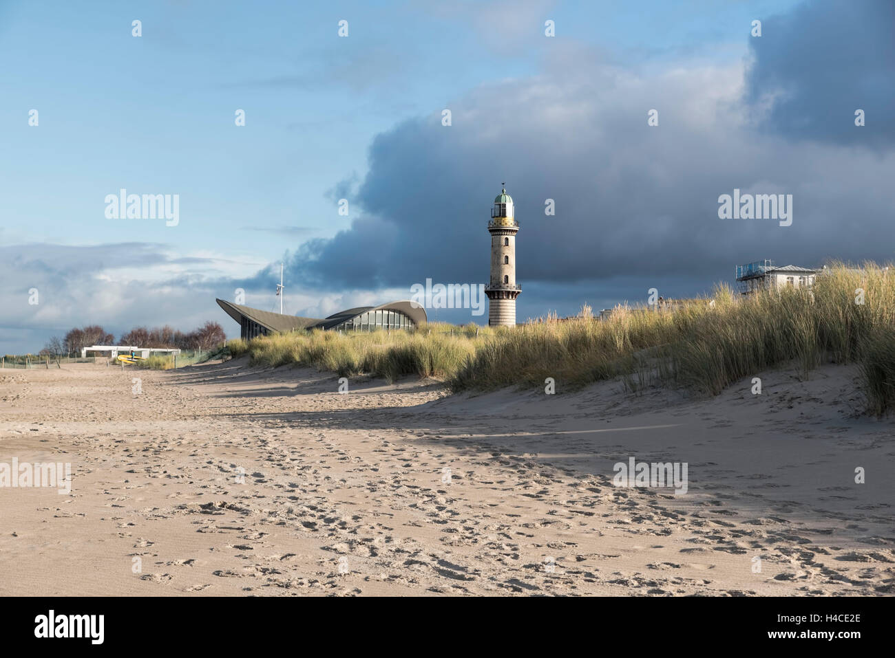 Lighthouse WarnemÃ¼nde in winter, marvellous cloud formation at ice-cold temperatures, Stock Photo