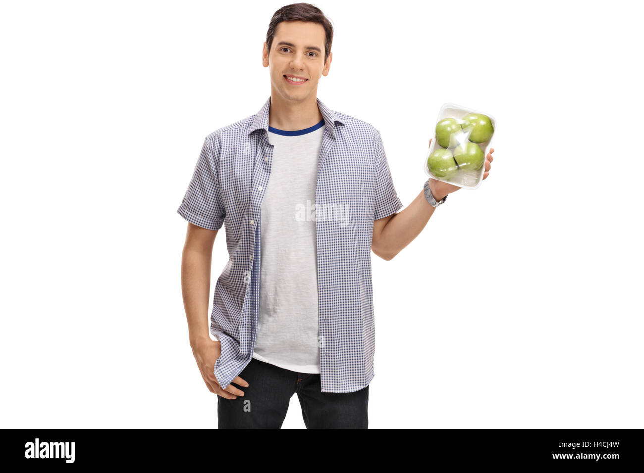 Joyful guy holding a pack of apples isolated on white background Stock Photo
