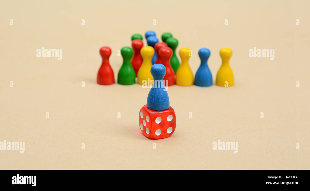 Leadership Concept with colorful pawns and dice. Stock Photo