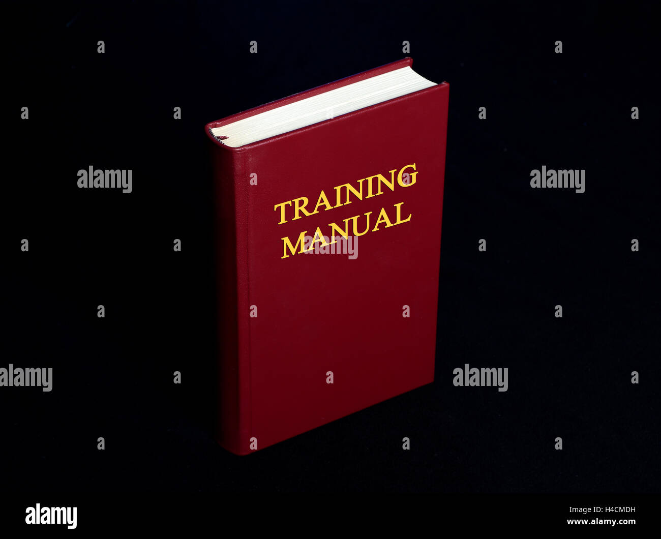 Training Manual Book Cover on Black Background. Stock Photo