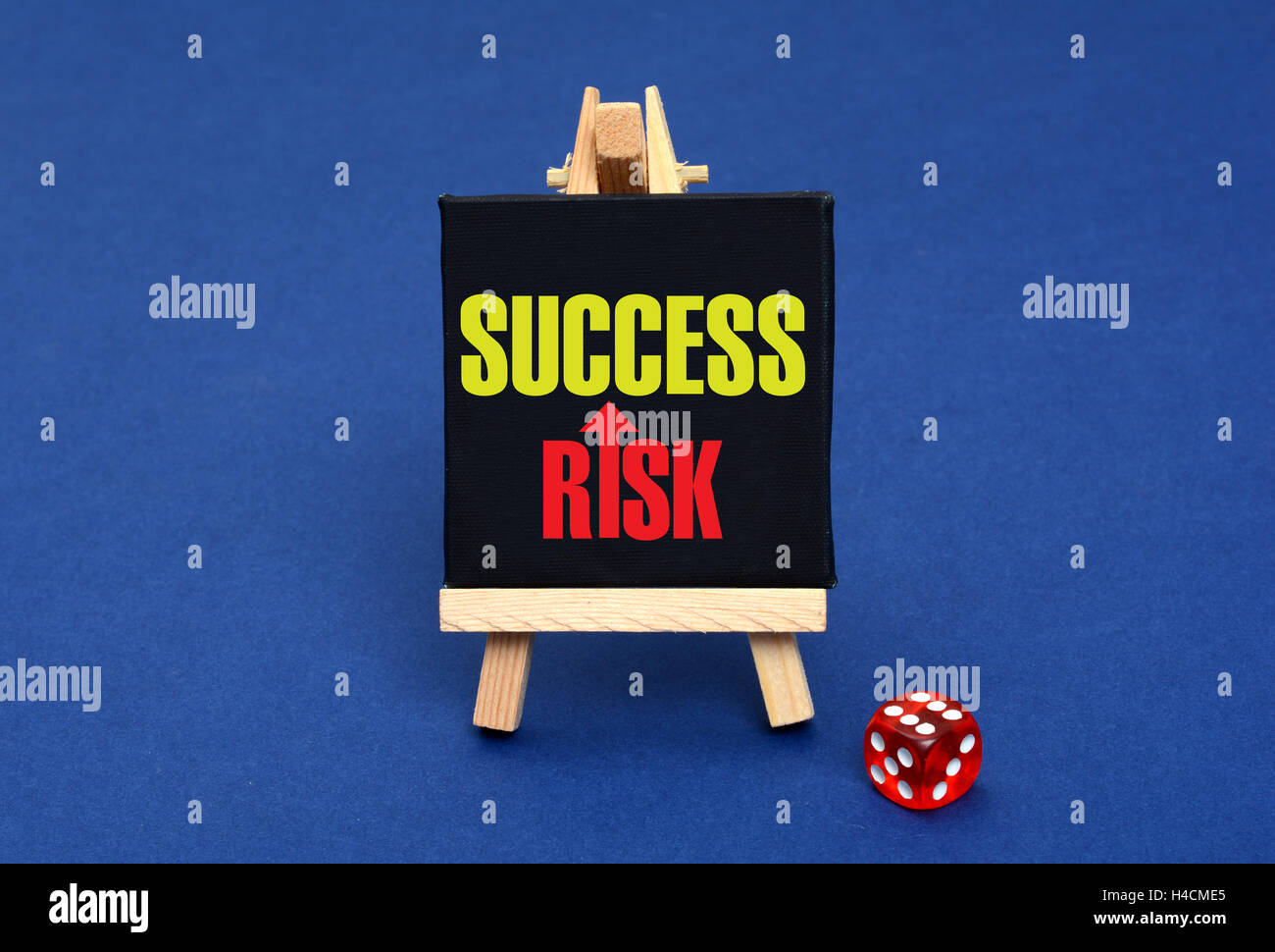 Risk Success Concept with dice and chalkboard. Stock Photo