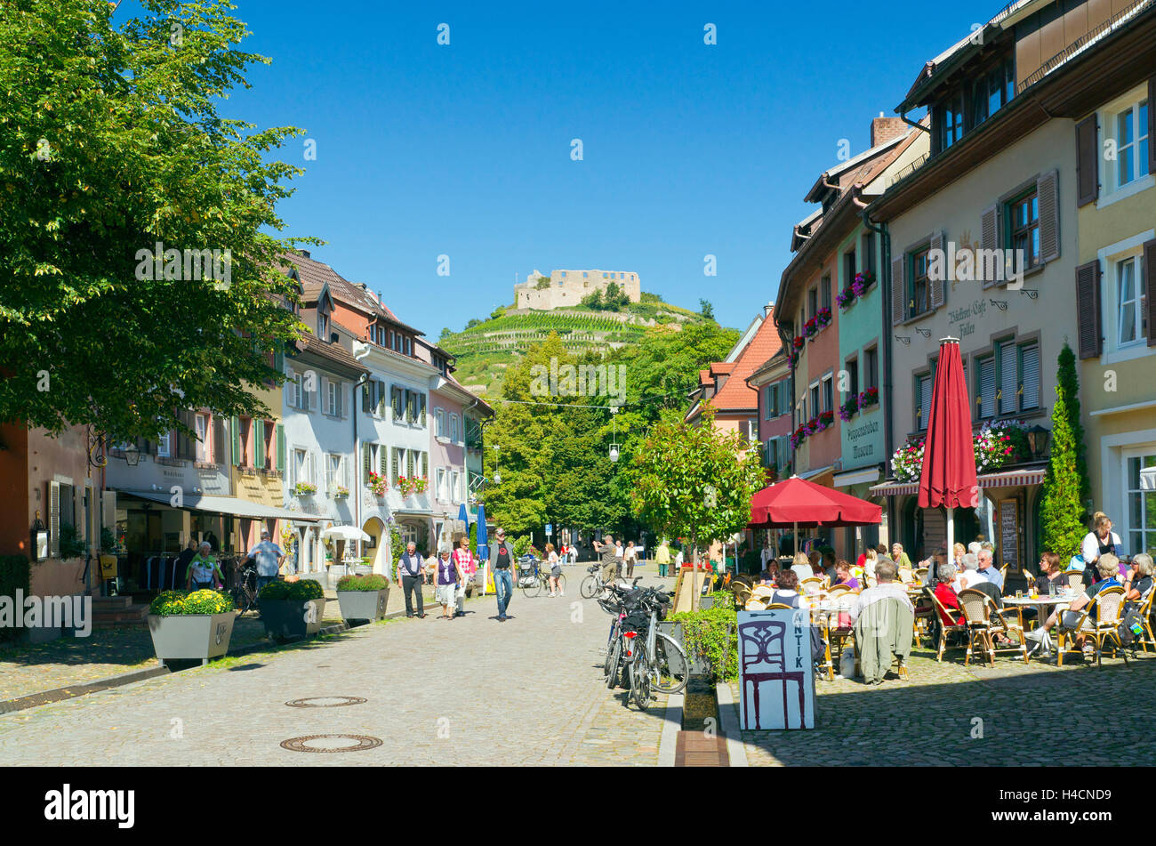 Germany, Baden-Wurttemberg, Staufen in the Breisgau, high street with view to the Schlossberg and castle Staufen Stock Photo
