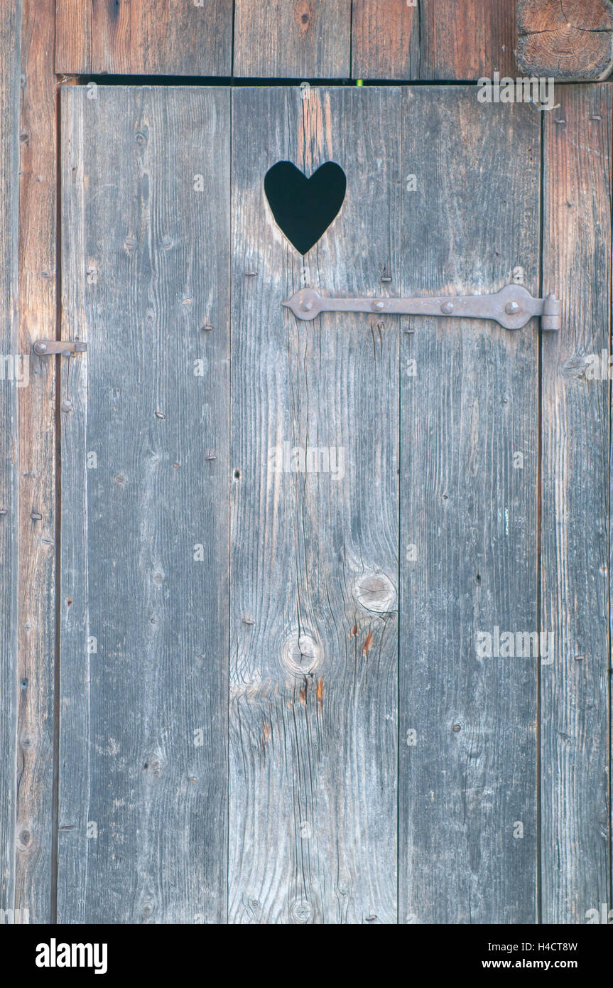 Earth closet with wooden heart door Stock Photo