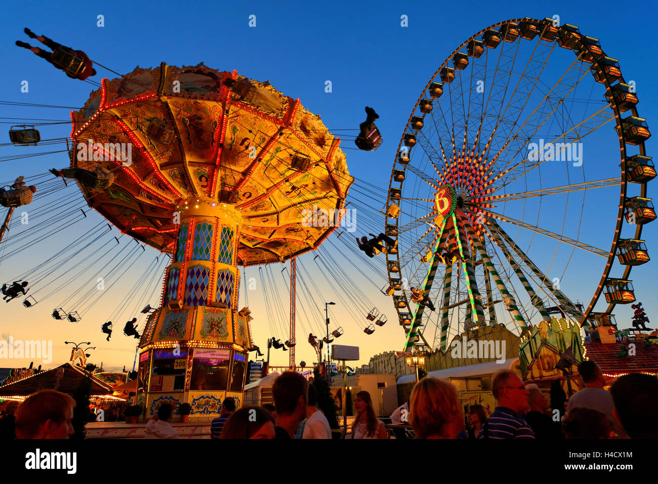 Swing Carousel With The Big Wheel In The Cranger Kirmes