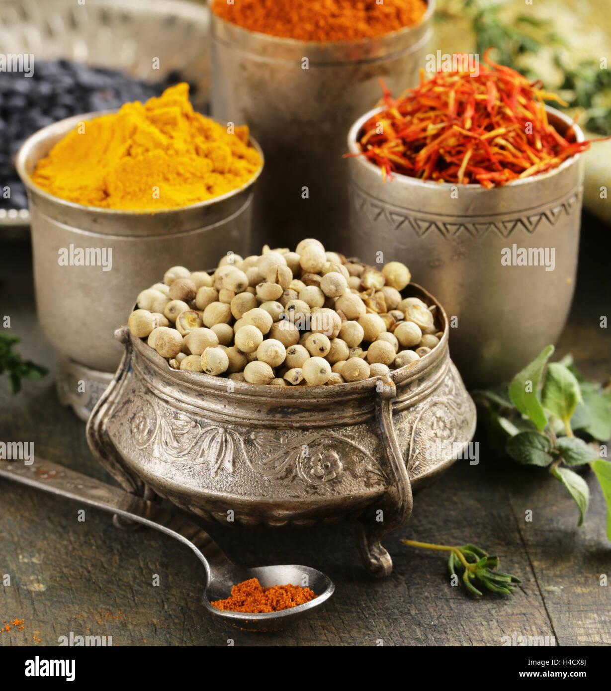 Assorted spices (saffron, pepper, turmeric, cinnamon Stock Photo Alamy