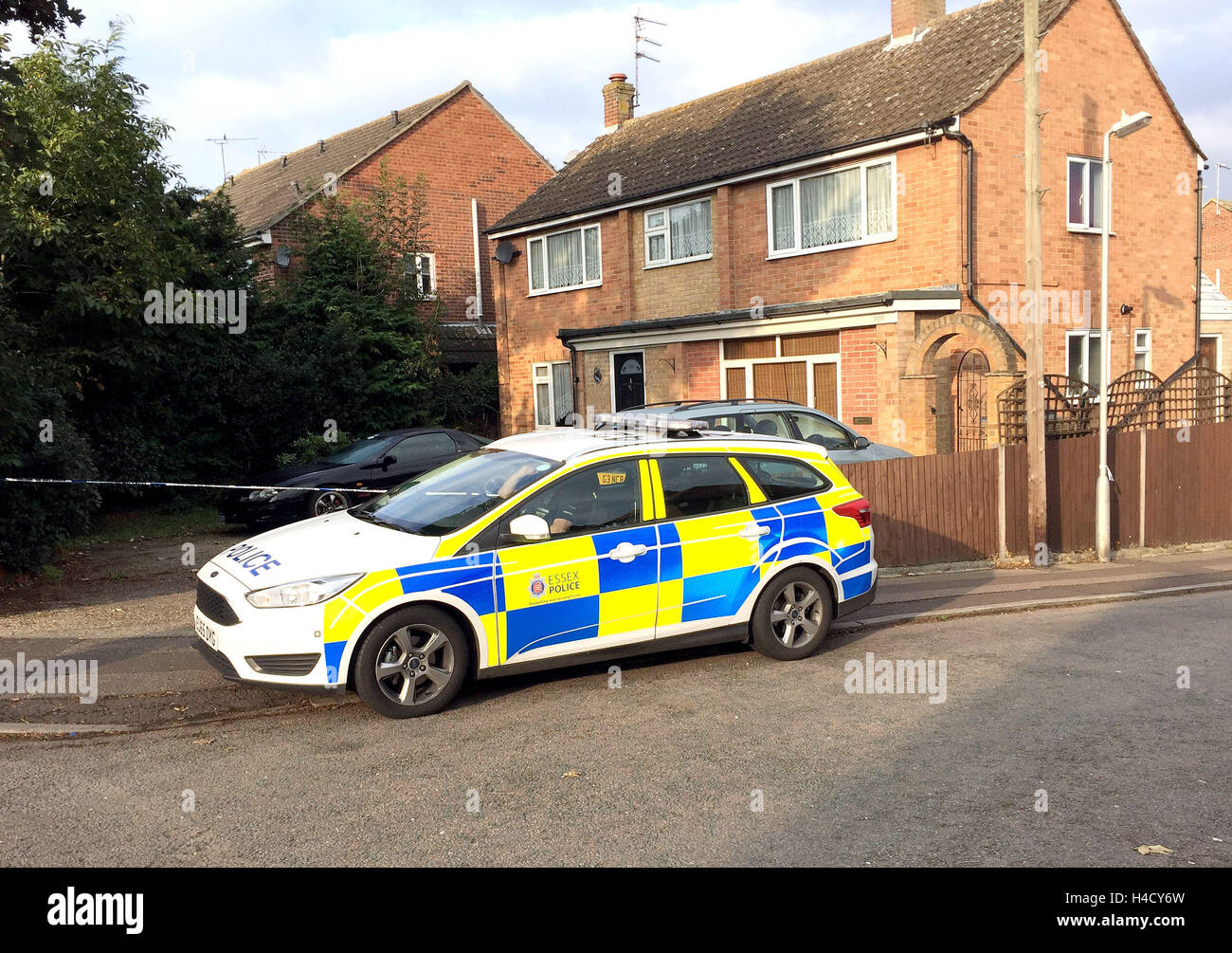 Police outside a house on the junction of Harwich Road with Tara Close in Colchester, Essex, after a baby boy was killed and a second child injured in a dog attack. Stock Photo