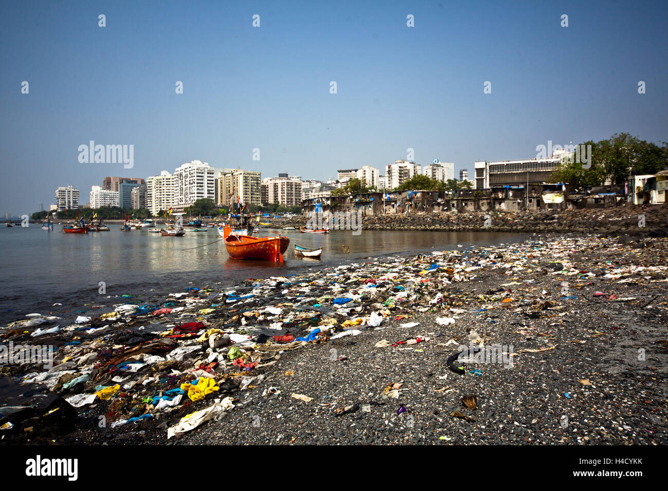 India, Mumbai, shore, garbage, fisherman's houses, high rises Stock Photo