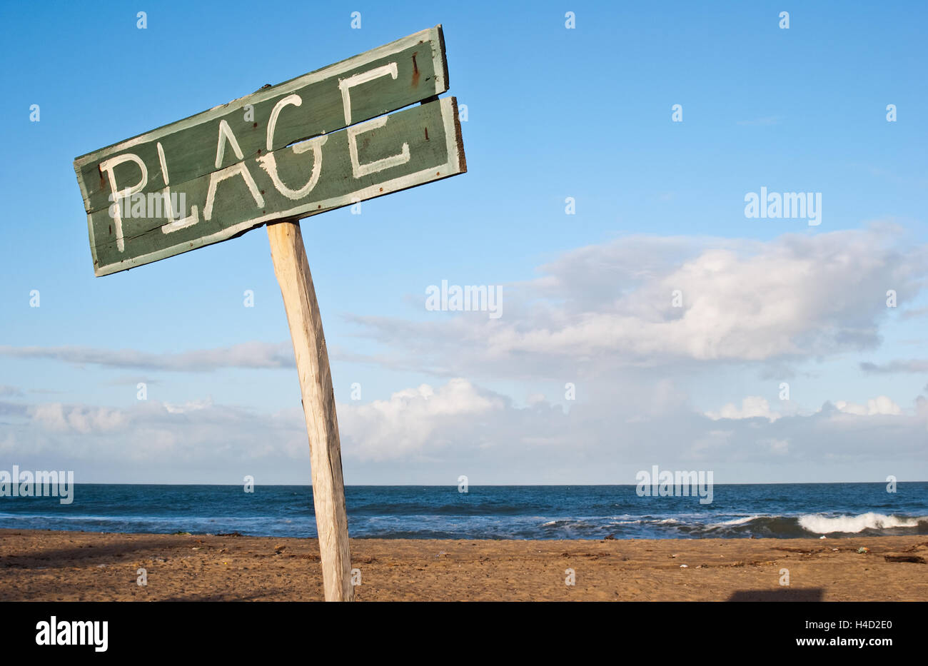Signpost on a beach. The word 'plage' (i.e. beach in french language) is written on the signpost. ( Madagascar) Stock Photo