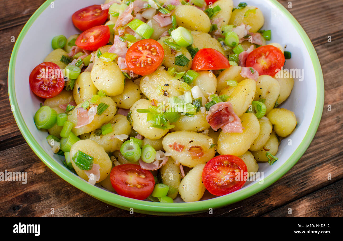 Gnocchi pasta with Black forest ham and spring onion Stock Photo Alamy