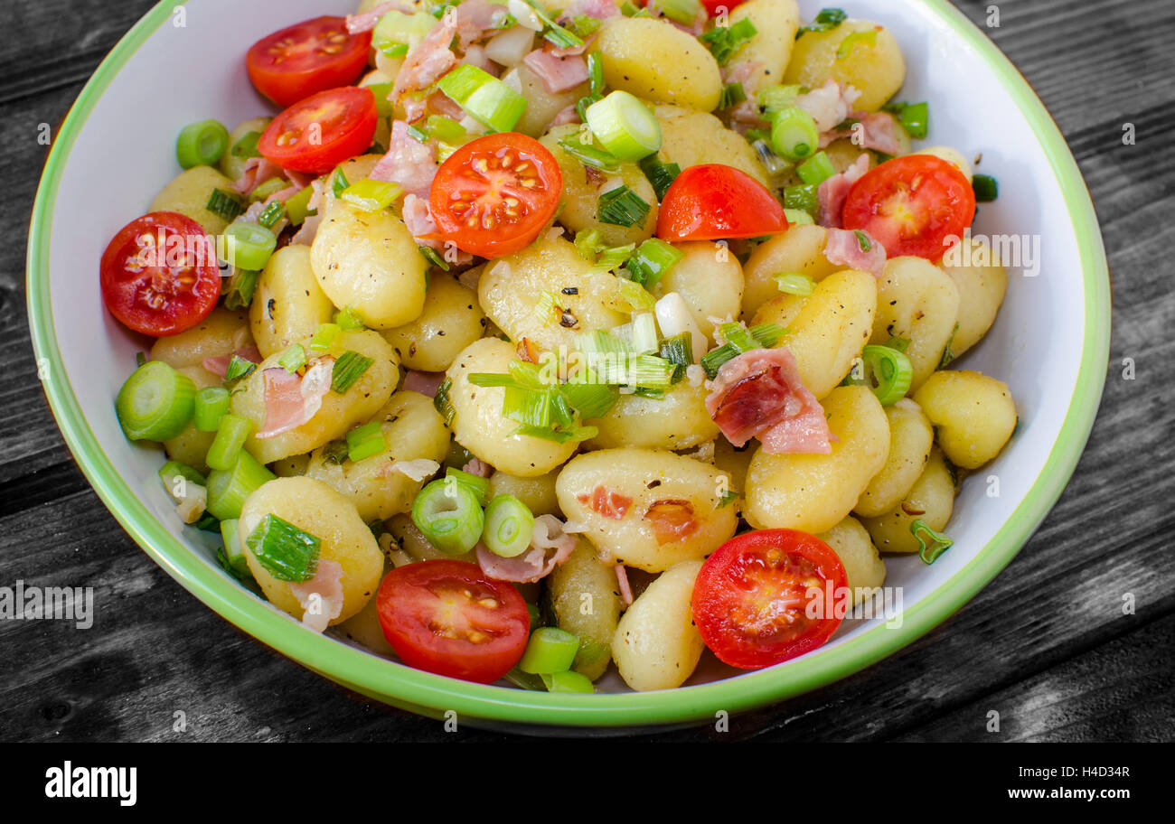 Gnocchi pasta with Black forest ham and spring onion Stock Photo Alamy