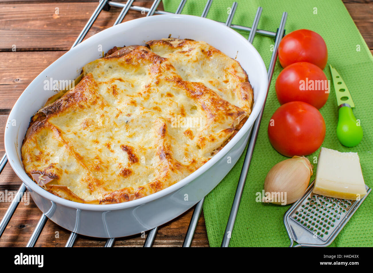 Lasagne bolognese in a baking dish, tomato and parmagio cheese Stock