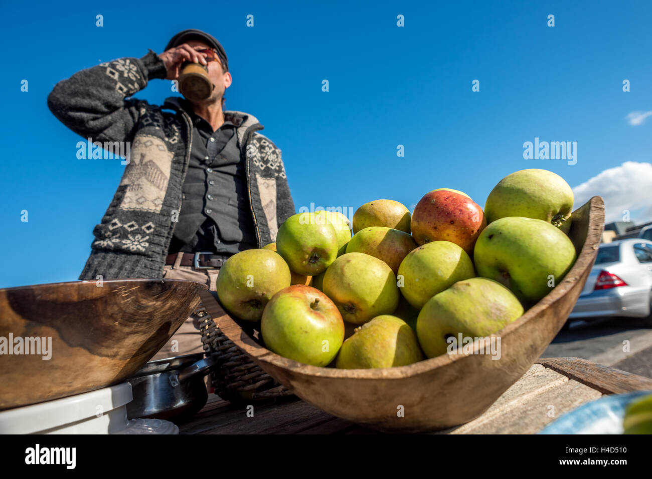 A man selling apples on Brighton seafront. Stock Photo