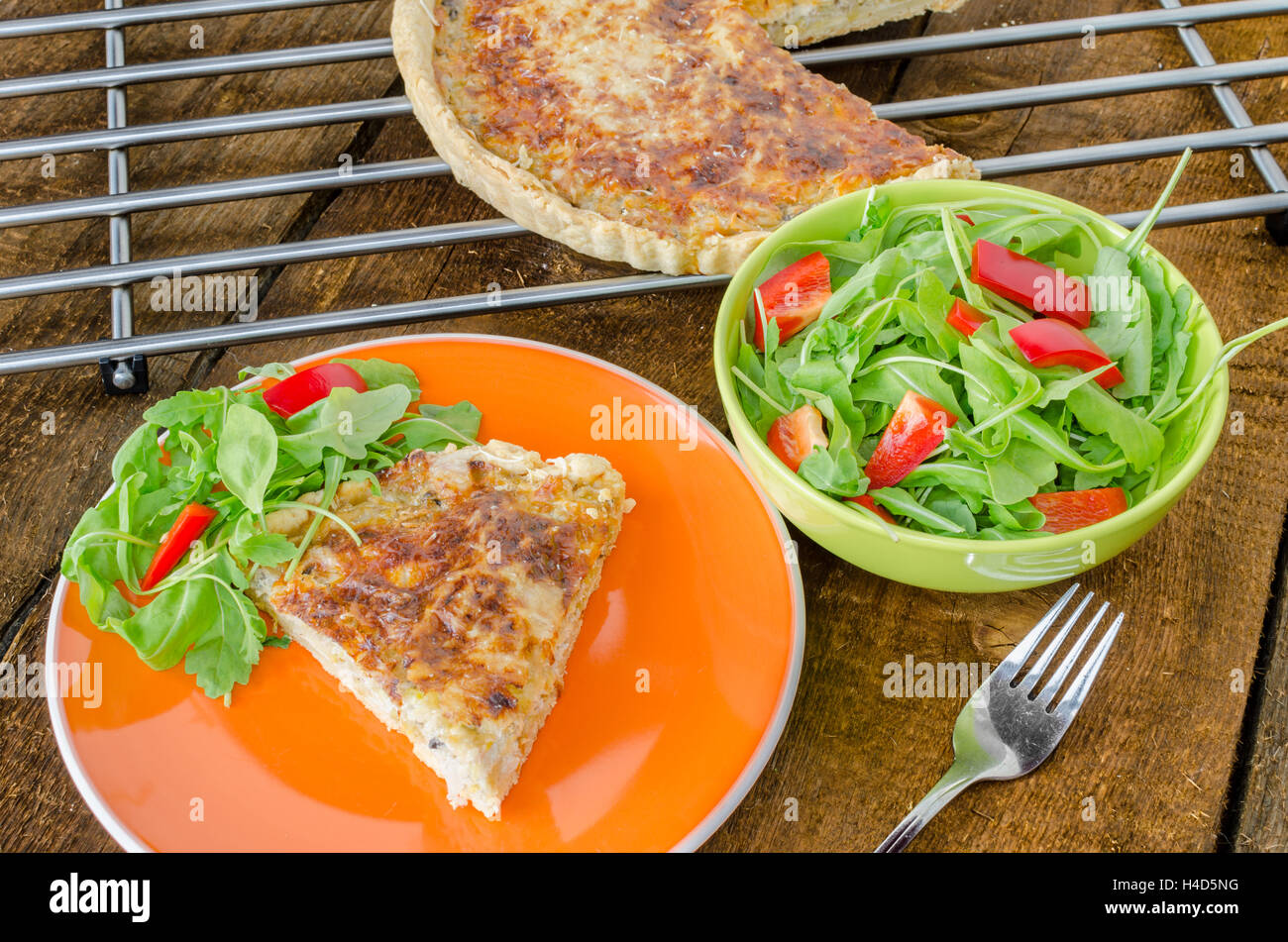 French quiche with cheese and salad paprica arugula Stock Photo Alamy