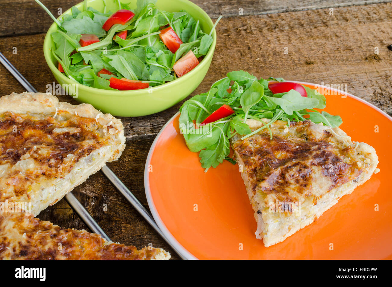 French quiche with cheese and salad paprica arugula Stock Photo Alamy