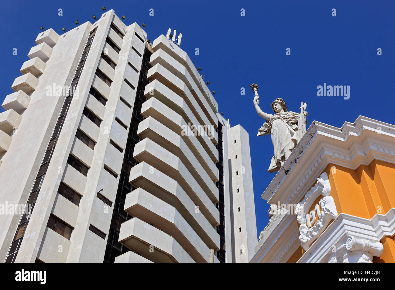 Republic Colombia, Departamento Bolivar, city Cartagena de Indias, high rise and part the archway with statues, input to the Century park Stock Photo