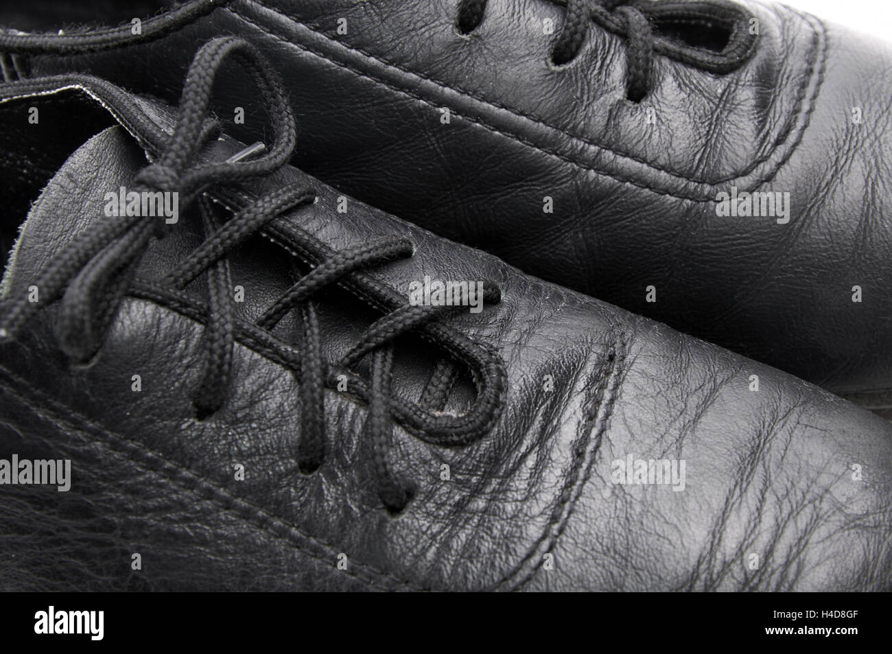 Lacing on a black leather ballroom shoe Stock Photo
