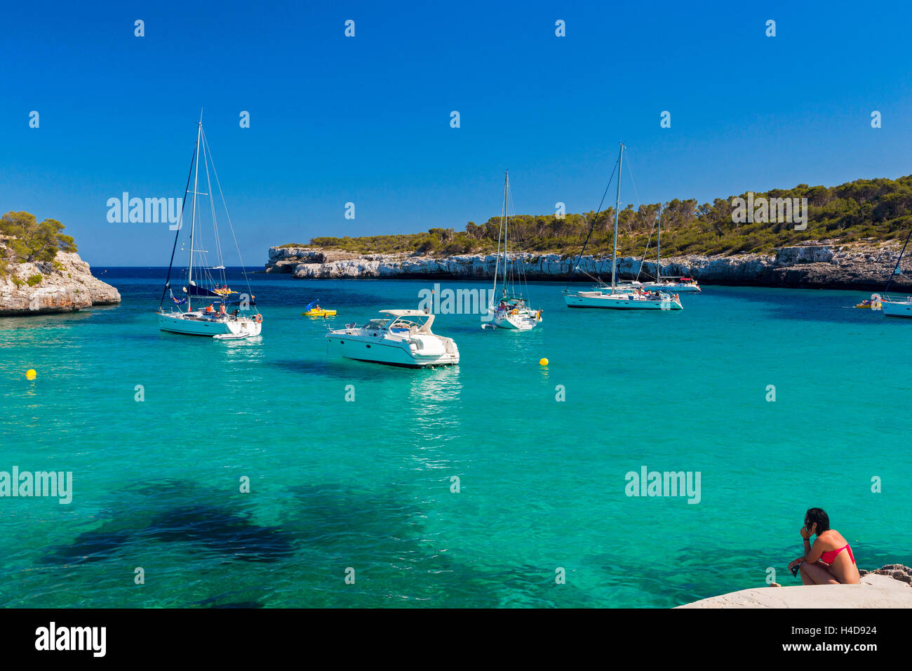 Boots in the bay Cala Mondrago, east coast the island Majorca, the Balearic Islands, Spain, Europe Stock Photo