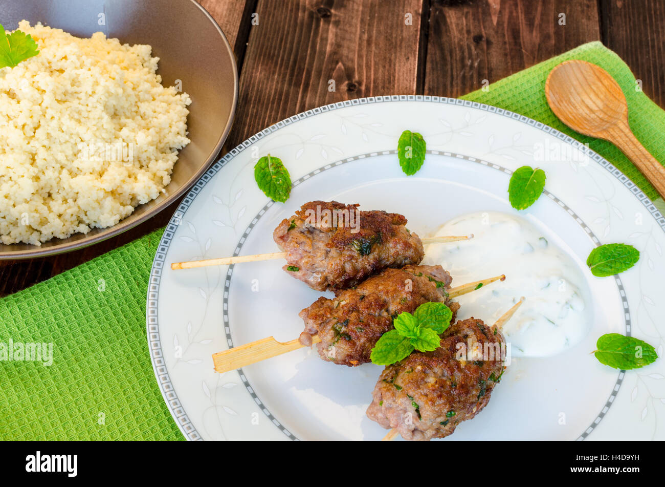 Beef kebab with coriander, garlic, couscous and mint dip Stock Photo