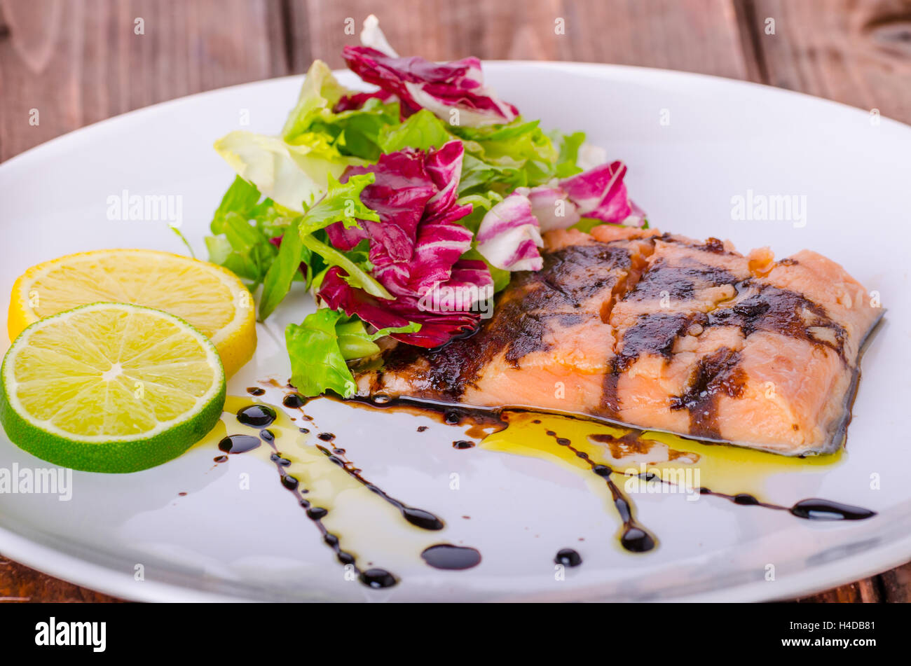 Salmon with a reduction of balsamic vinegar and sugar, fresh salad