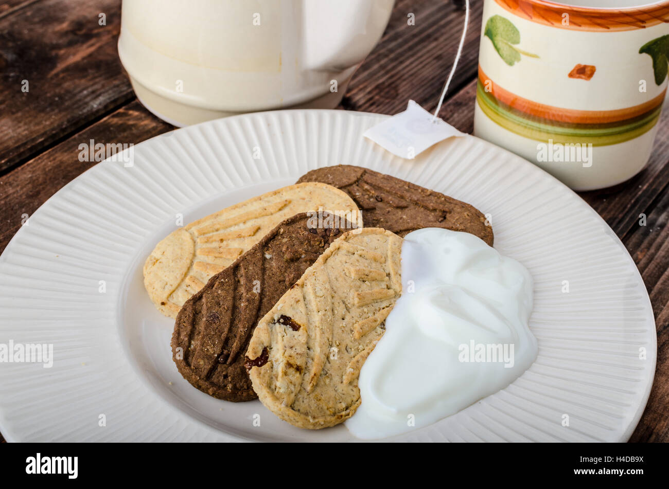 Breakfast home made grain crackers and tea and yogurt Stock Photo Alamy