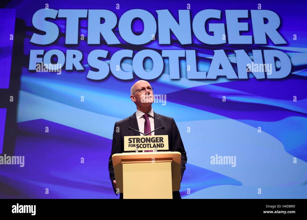 Deputy First Minister John Swinney delivers his speech at the SNP conference in Glasgow. Stock Photo