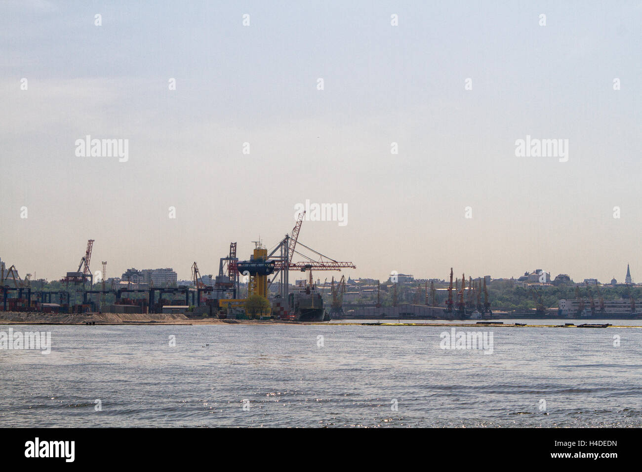 Cargo crane, ship and grain dryer in port Odessa, Ukraine Stock Photo