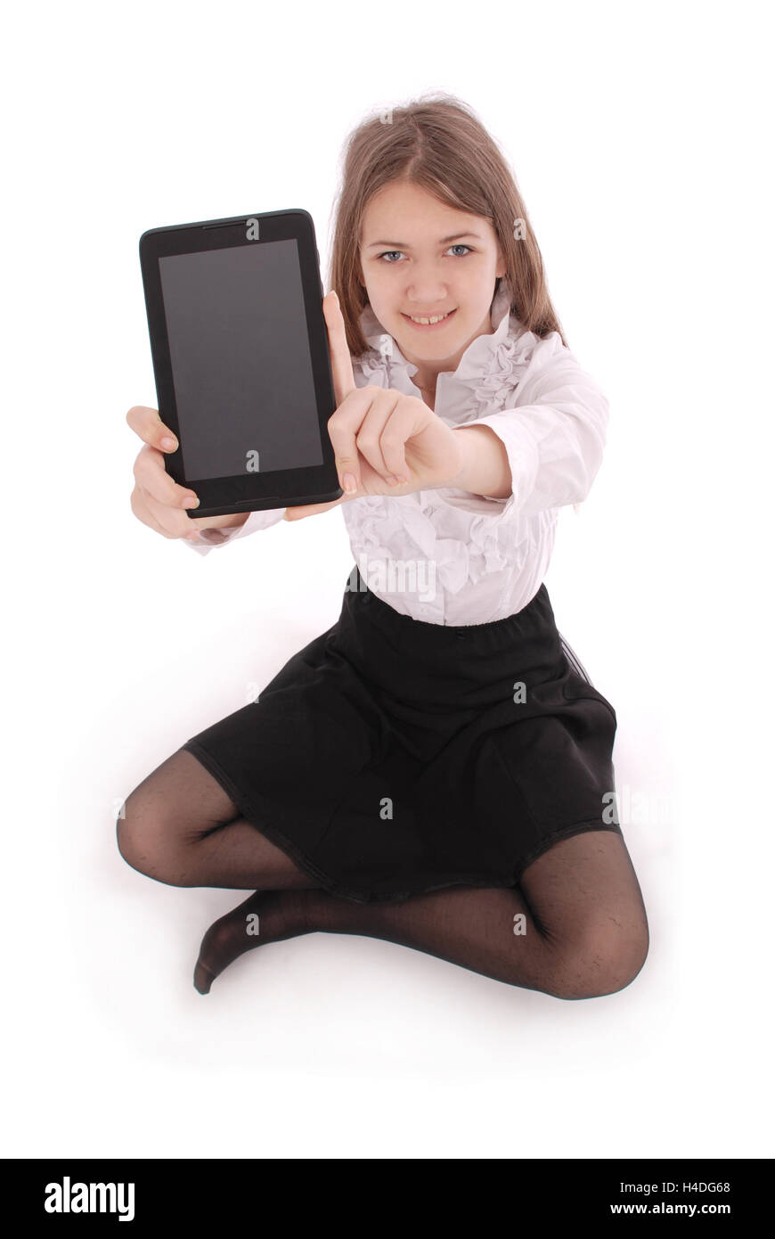 Beautiful young woman holding digital tablet sitting on the floor ...