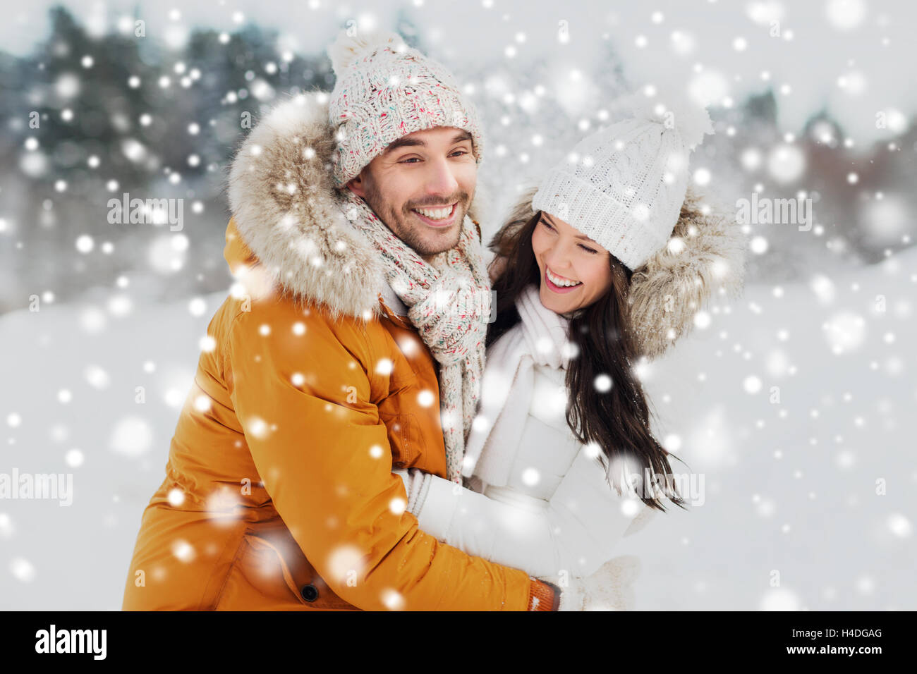 happy couple hugging and laughing in winter Stock Photo - Alamy