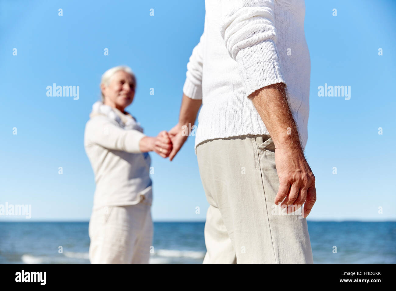 Closeup couple holding hands walking hi-res stock photography and ...