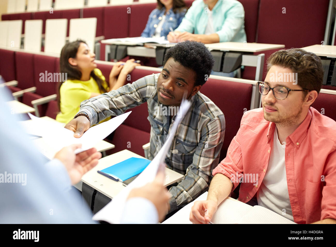 teacher giving tests to students at lecture Stock Photo - Alamy