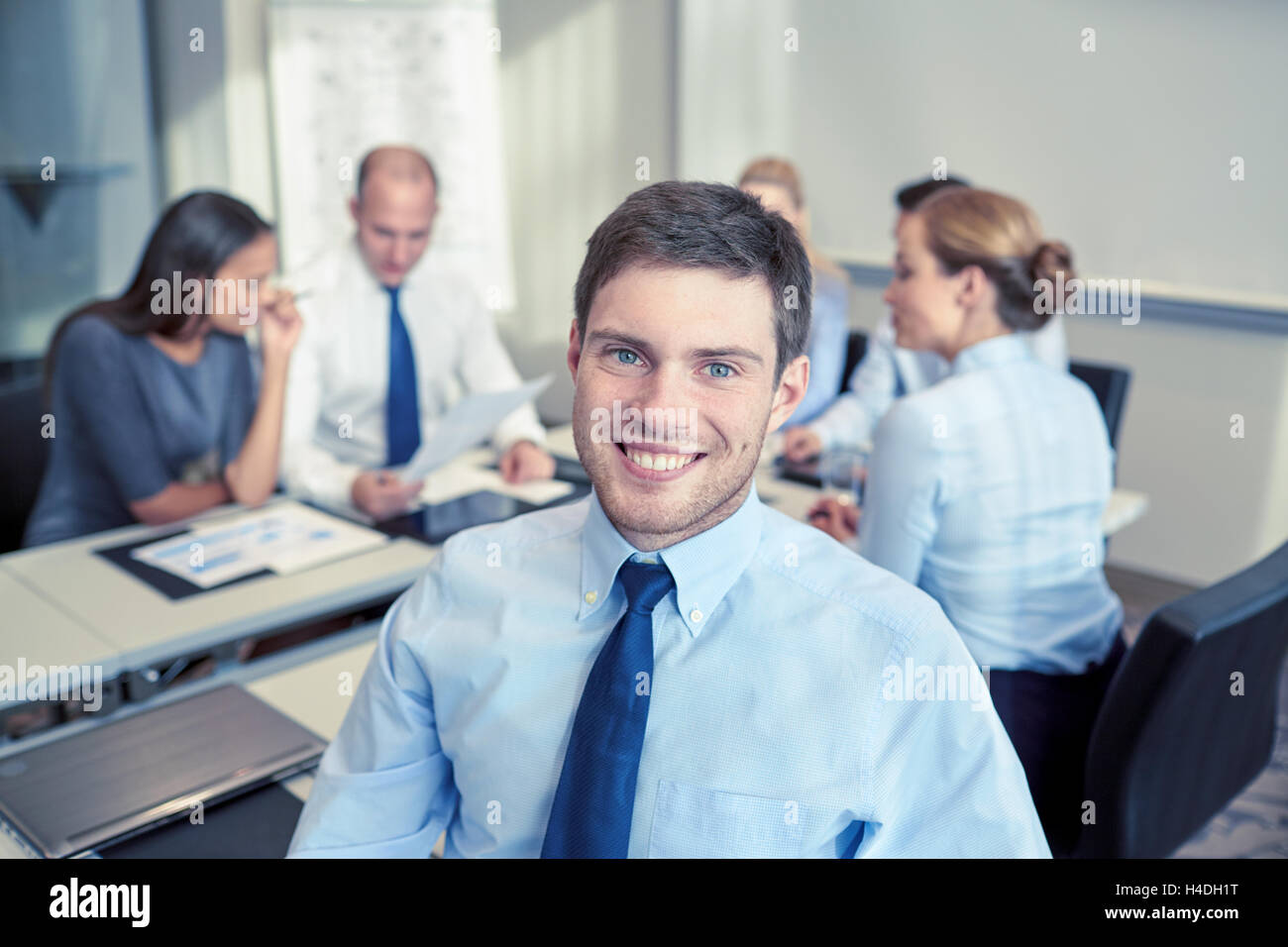 group of smiling businesspeople meeting in office Stock Photo - Alamy