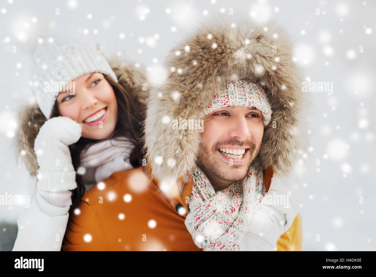 happy couple having fun over winter background Stock Photo - Alamy