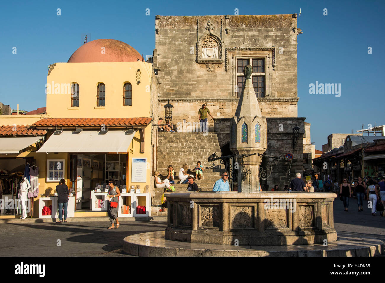 Rhodes, Platia Ippokratou with well and Kastellania Stock Photo