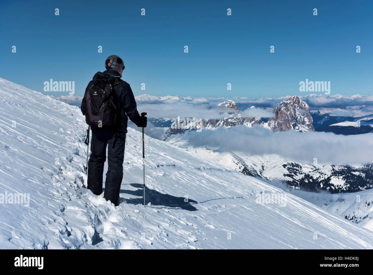 Wanderer on Marmolada in front of Langkofel, Dolomites, Italy Stock Photo