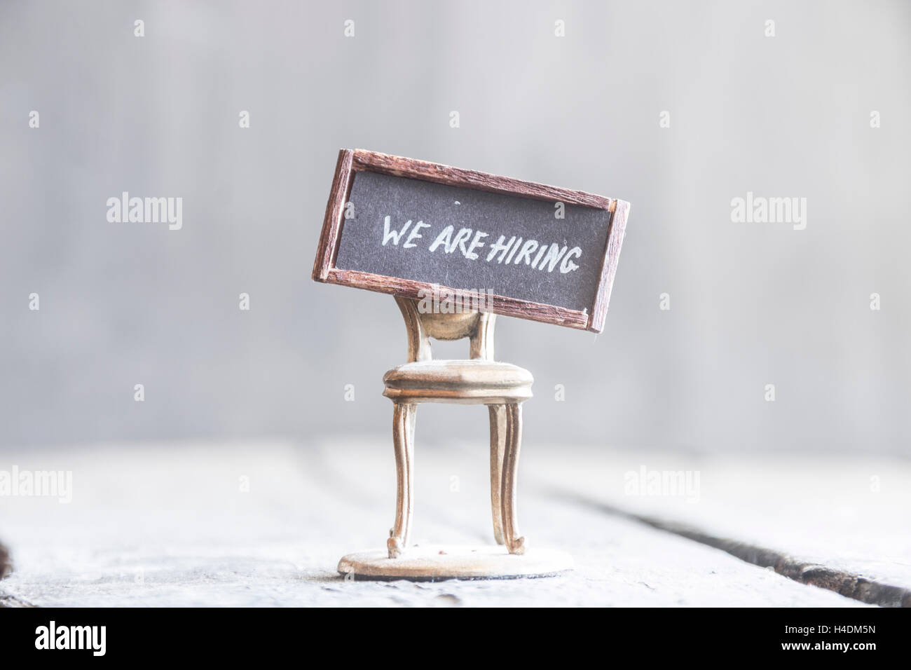 We're hiring idea, text and chair, retro style. Stock Photo