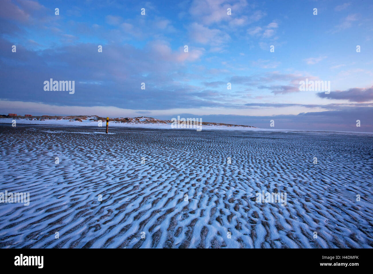 ripple marks made of sand and snow on the beach of Sankt Peter-Ording in the evening light, Stock Photo